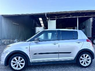 uszkodzony samochody osobowe Suzuki Swift 1.3i 92pk GLS 5drs - nap - airco - camera - touchscreen multimedia - bleutooth - alcantara hemel + stuur 2006/10